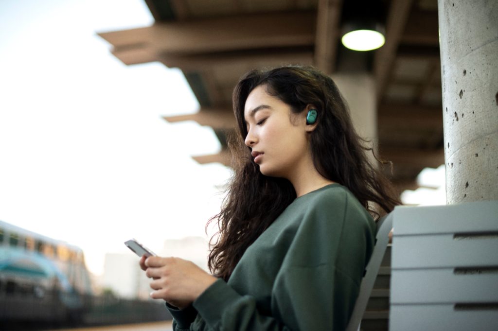 woman wearing Skullcandy Push Earbuds