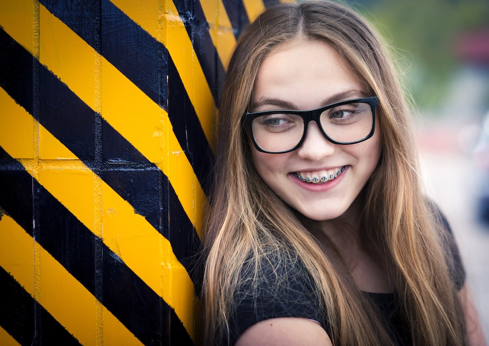 Urban hipster girl with braces